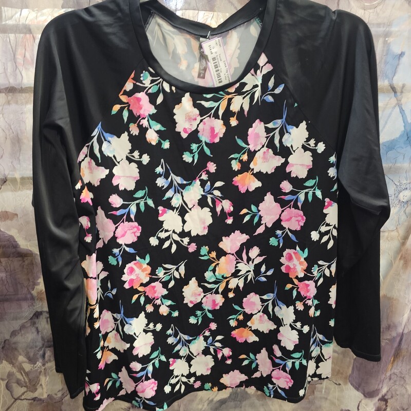 Long sleeve quick dry top in black with floral pattern.