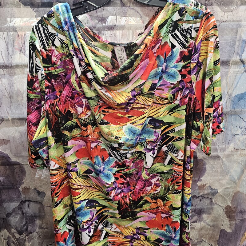 Love this scoop neck blouse in a fun bold multicolored print  with short sleeves.