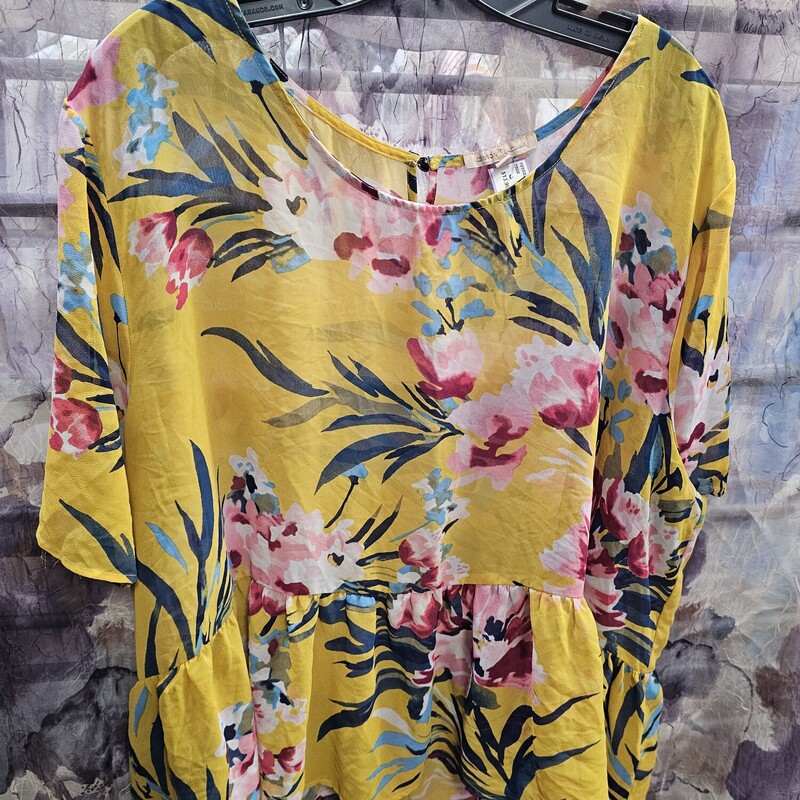 Half sleeve somewhat sheer blouse in mustard yellow and floral print. Super cute