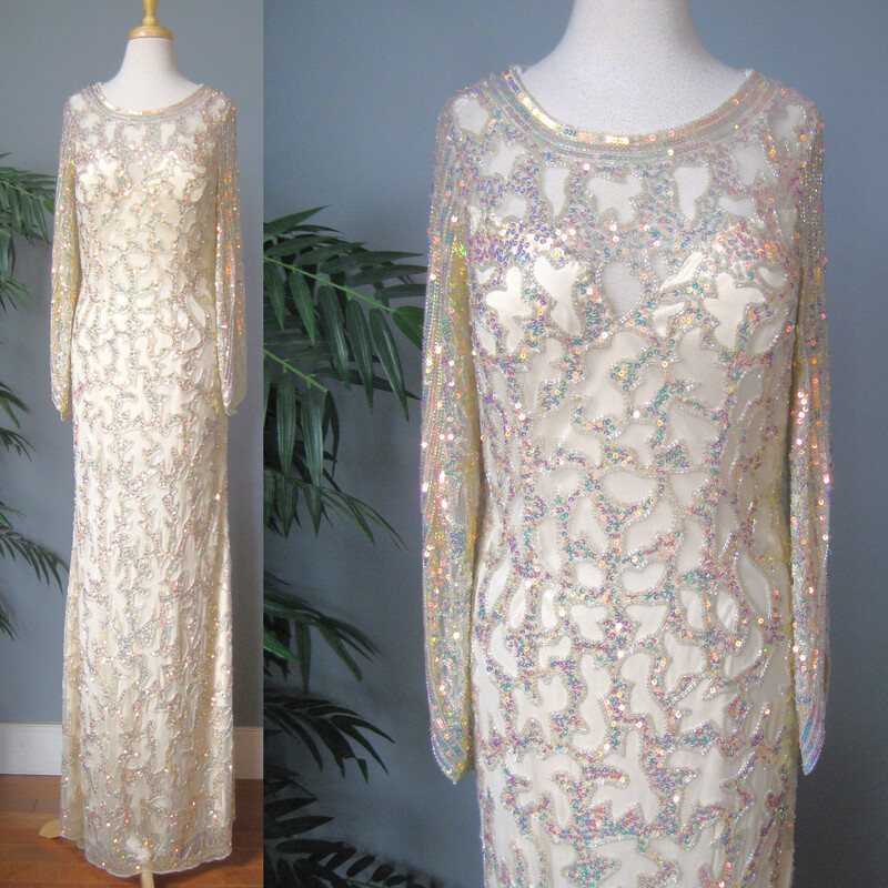 You are a shimmering goddess in this long extremely fancy HEAVY white gown by Primavera.
It's lavishly beaded and sequined with irridescent clear and peach sequins and clear beads.
It has a small train at the back
The sleeves are long in the back and shorter in the front, giving almost a renaissance feel.

Marked Size 12 but it may well not work for a modern size twelve, so please use the garment's actual measurements provided here. And let's chat if you need help determining if it will work for you. You will want the gown to fit to the body but there is not any stretch. It had a side zipper

Flat Measurments:
shoulder to shoulder: 14
Armpit to Amrpit : 19
Waist: 14.5
Hips: 18 you want it close here, and because of the bias cut, there is some give here, so you could probably get it on if your hips are 40 around or less.
Length: 61 in the front and about 72 in the back. a little bit of this length will be taken up by the body filling out the hips.
Sleeves: 13.5 in the front 18 in the back.


Thanks for looking!
#69200