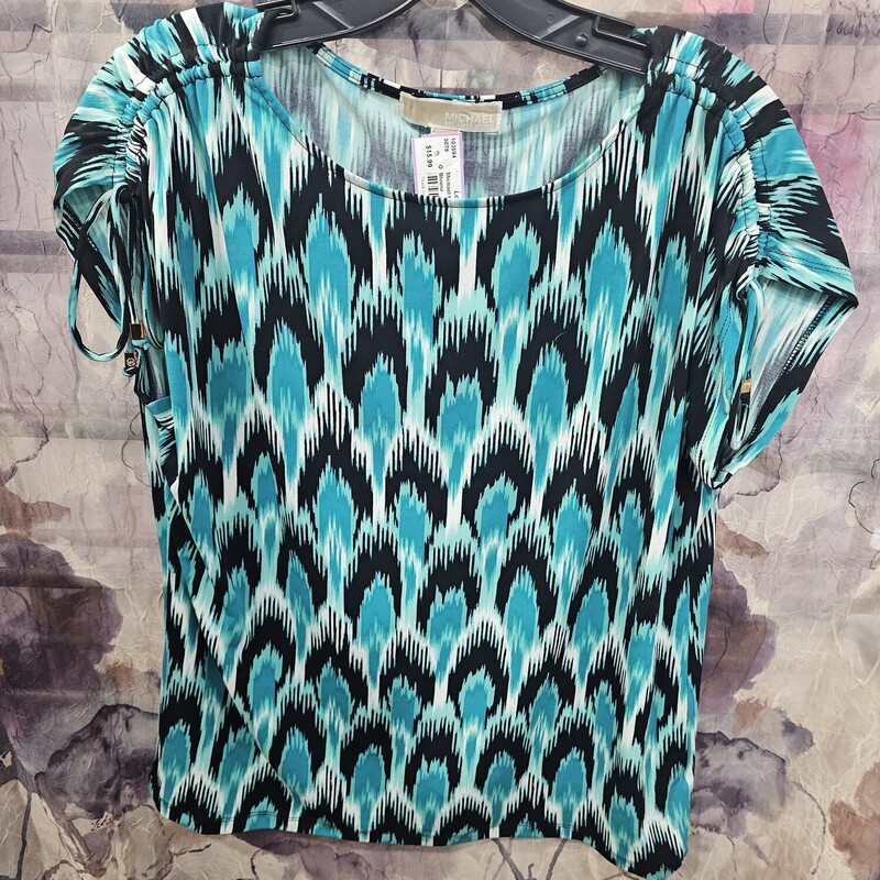Super cute short sleeve blouse in a fun print with black, white mint green and teal.