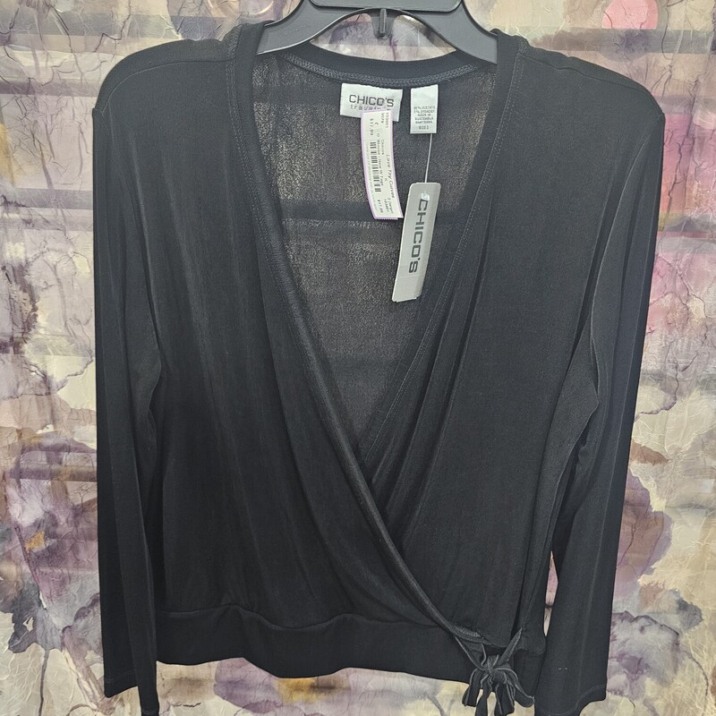 Retailing for $78! This blouse is brand new with tags, wrap style long sleeve and perfect year round.
