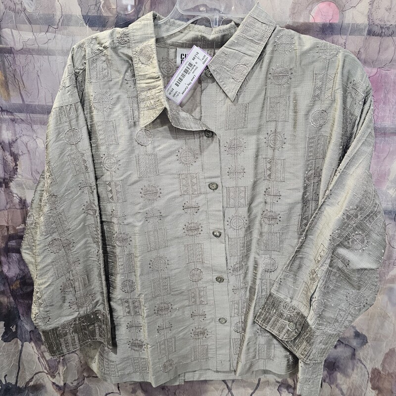 Half sleeve button up front top in a taupe color with embroidered design.