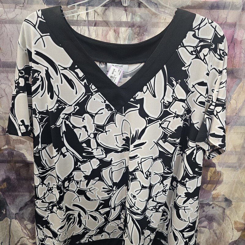 Short sleeve blouse in black white and beige floral bold print.