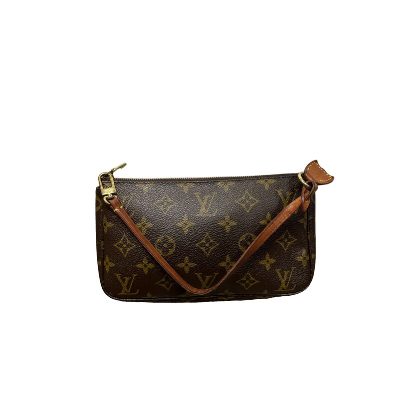 LOUIS VUITTON Monogram Pochette Accessories. This pochette is crafted of signature Louis Vuitton monogram coated canvas in brown. The bag features a removable vachetta leather strap and gold-toned hardware. The top zipper opens to a brown fabric interior.<br />
Dimensions:<br />
Length: 8.5 in<br />
Height: 5 in<br />
Width: 1.5 in<br />
Drop: 6.5 in<br />
CodeSL0978