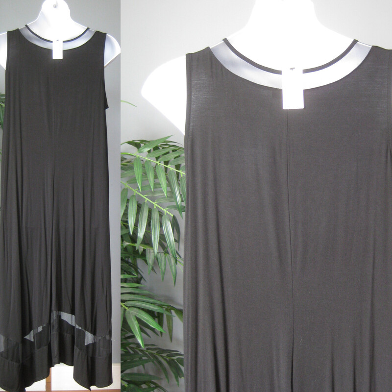 Elegant but comfortable knit maxi dress with a bit of flare.<br />
Sleeveless relaxed fit with mesh insets at the neck and hem.<br />
pockets<br />
dress her up or down, add a belt or wear loose you'll look special either way.<br />
Pockets!<br />
Solid Black<br />
NEW WITH TAGS<br />
<br />
marked size 18/20<br />
Orginal Price $59.97<br />
Flat measurements: taken with the garment lying flat and unstretched.<br />
armpit to armpit: 22.5<br />
waist area: aprox 26<br />
hip area: aprox 30<br />
length: 49.5<br />
<br />
perfect brand new condition.<br />
thanks for looking!'<br />
#69907