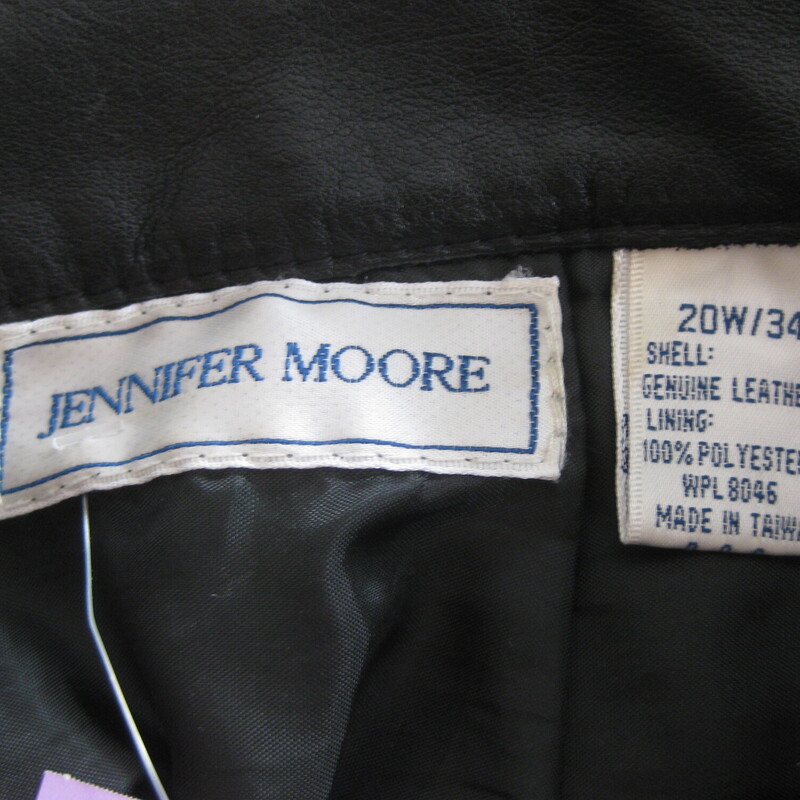 Very simple below knee length black leather skirt.  This straight leather skirt is lined for shape and comfort and fastens with a center-back snap and zipper. It's by Jennifer Moore.<br />
made in Taiwan<br />
Marked size 20W 34, in my opinion this skirt will fit bigger than that, please compare the measurements below to a skirt you have that fits you well, and/or refer to the skirt size charts of a manufacturer that you know fits you well.  I'm here to help if you have questions about the fit.<br />
<br />
Flat measurements, please double where appropriate:<br />
<br />
Waist: 16.5<br />
Hips: 23.75<br />
Length: 26.5<br />
Excellent condition.<br />
<br />
Thank you for looking.<br />
#66226