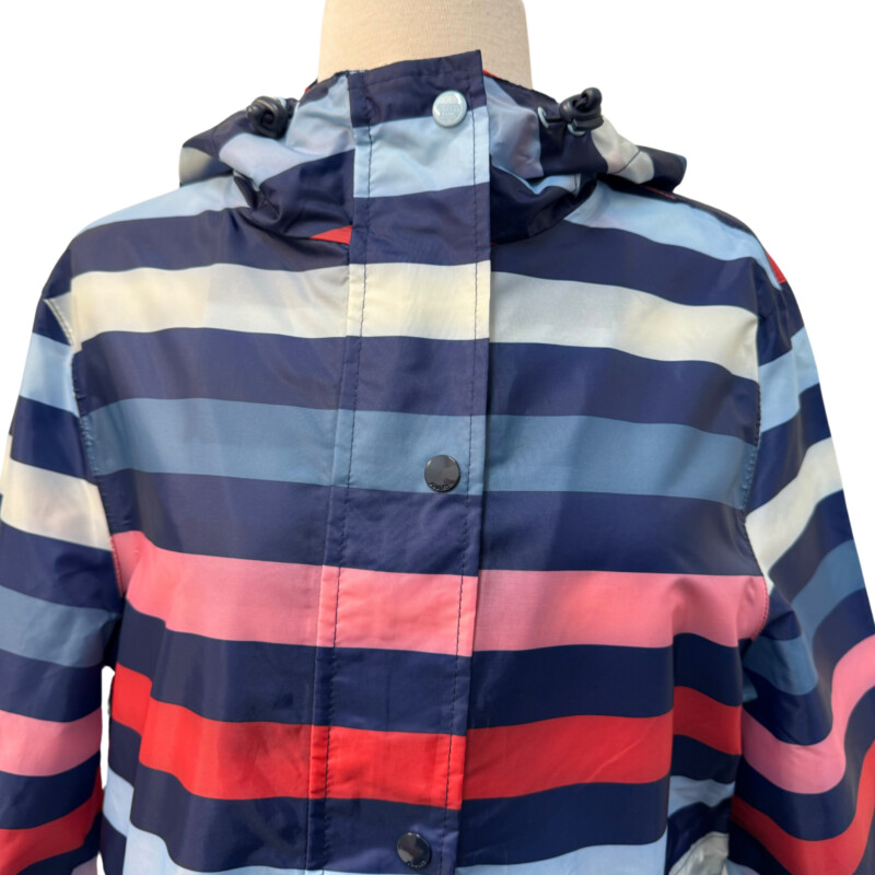 Joules Striped Rain Jacket<br />
Right as Rain Collection<br />
Outwit the Weather<br />
Hooded with Adjustable Cinch Waist<br />
Packable<br />
Stripes of Navy, Pink, Red, Blue, and Deep Teal<br />
Size: Medium