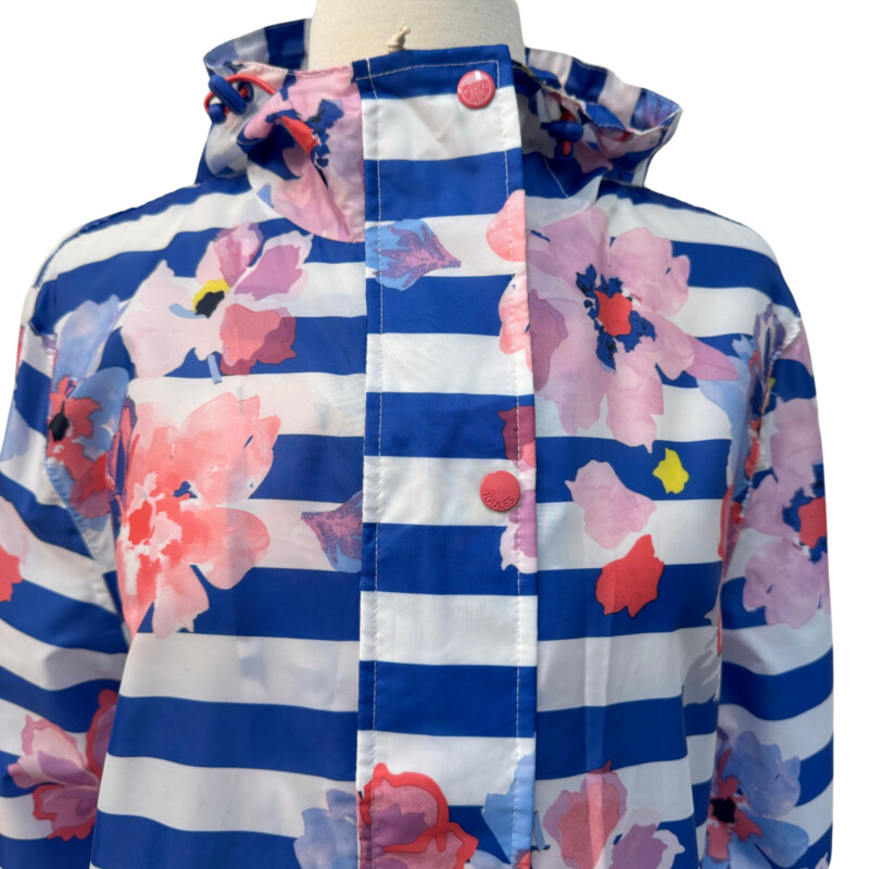 Joules Floral Rain Jacket<br />
Right as Rain Collection<br />
Outwit the Weather<br />
Hooded with Adjustable Cinch Waist<br />
Packable<br />
Floral and Stripes with Blue, White, Pink and Coral<br />
Size: Medium