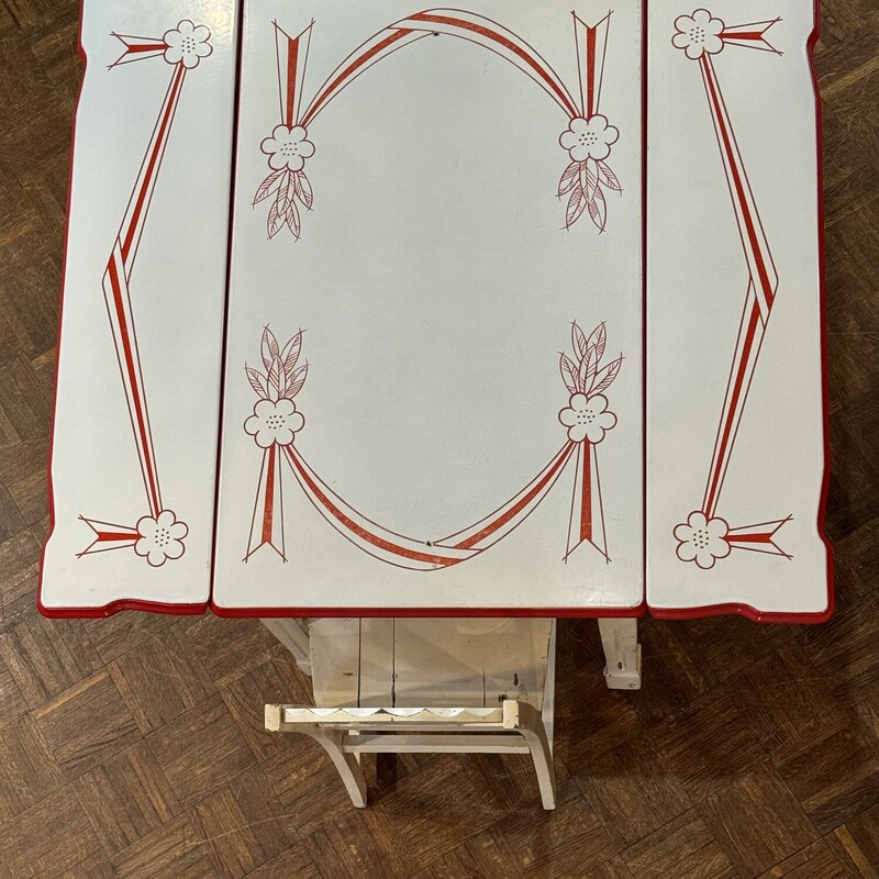 Beautiful Vintage Red and White Enamel Table<br />
with Two Wooden Chairs.<br />
45 In Width (Open) x 24 In Width (Closed) x 40 In Length x 31 In Tall.