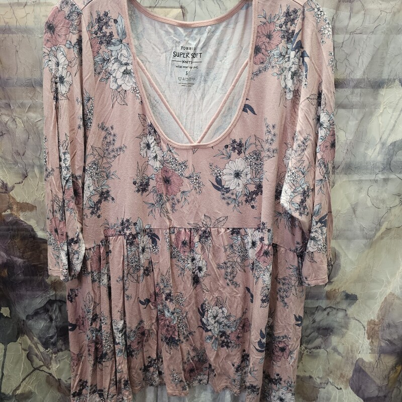 Short sleeve knit top in pink with floral print and baby doll cut