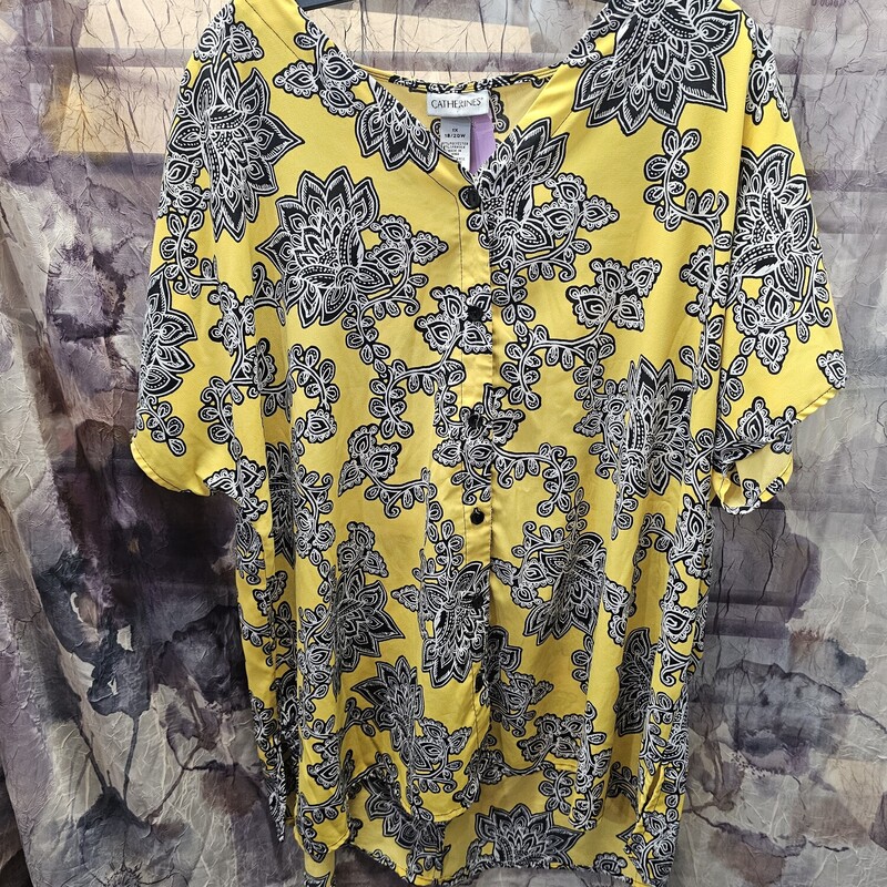 Button up blouse in yellow with black and white print and short sleeves.