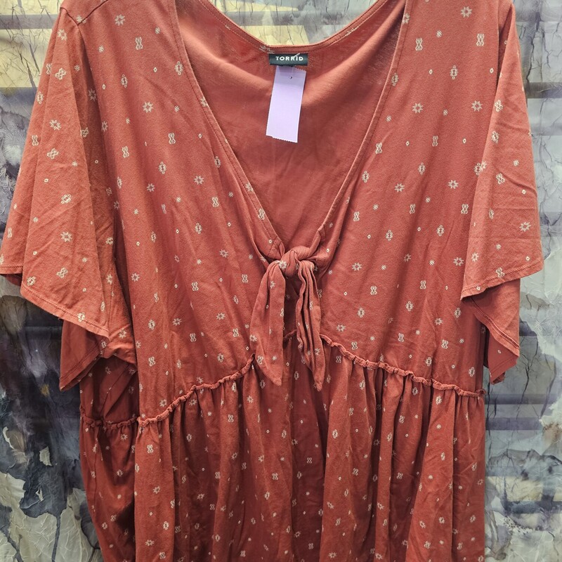 Short sleeve knit top with cincheable waist in a burnt orange. Super cute.