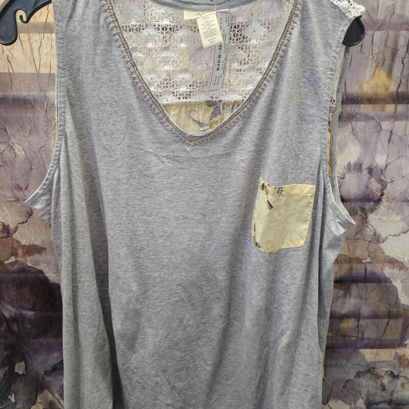 Super cute tank with grey knit in front and poly panel in the back in yellow with floral print.