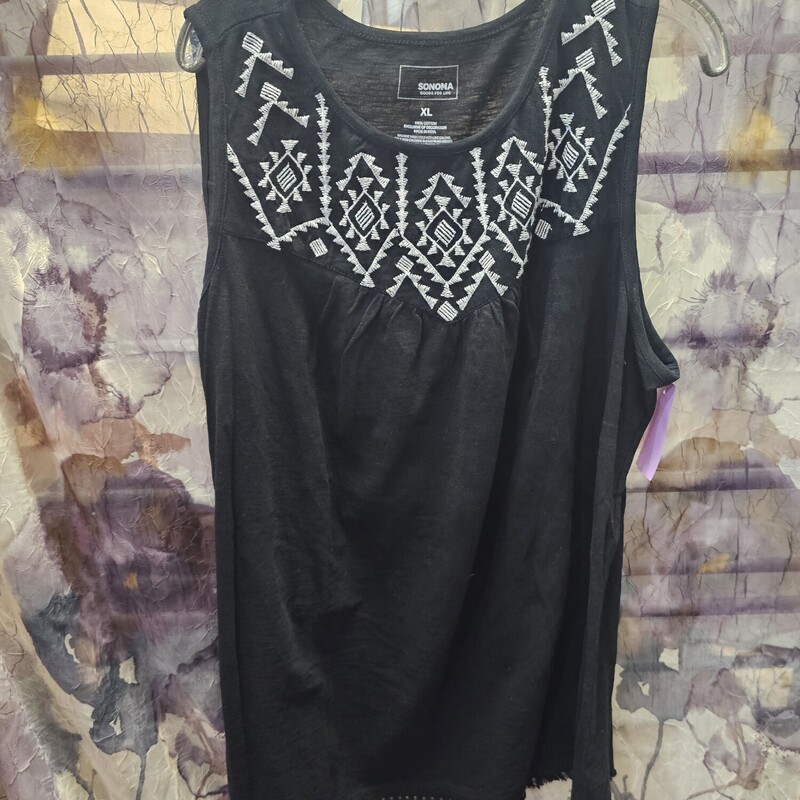 Super cute black tank with white embellished chest panel.