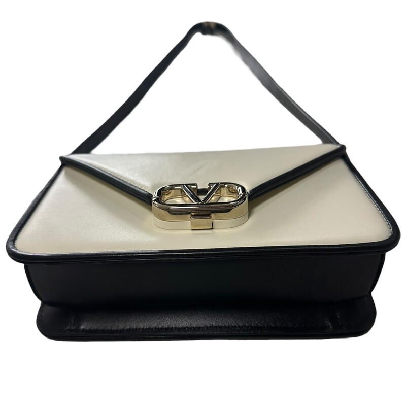 Valentino Letter Shoulder, Cream, Size: 2023

Dimensions:
Height 7in
Width 9.5in
Adjustable Strap

Note: Scratch on the front on the bag

This Valentino Garavani shoulder bag honours the brand's iconic VLogo Signature with a gleaming gold-tone plaque at the centre of the leather construction. A versatile design, it can be worn in many ways to its adjustable top handle.