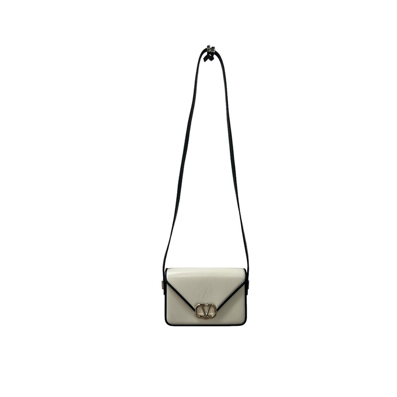 Valentino Letter Shoulder, Cream, Size: 2023

Dimensions:
Height 7in
Width 9.5in
Adjustable Strap

Note: Scratch on the front on the bag

This Valentino Garavani shoulder bag honours the brand's iconic VLogo Signature with a gleaming gold-tone plaque at the centre of the leather construction. A versatile design, it can be worn in many ways to its adjustable top handle.