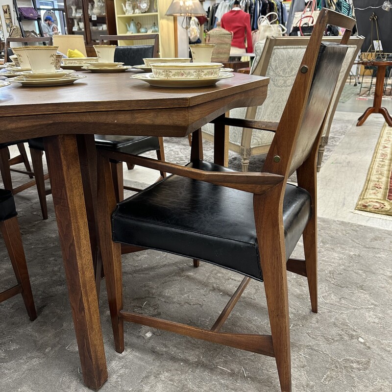 Stunning Mid-Century Modern Dining Table Set, in gorgeous condition. Includes the 48in hexagonal table, three 15in leaves, and six chairs. Stunning set!