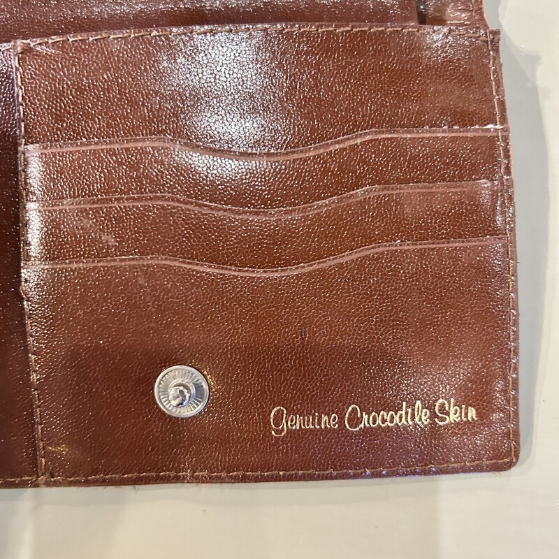 Crocodile Skin Wallet
Size: 5 x 4
Inside it reads: Genuine Crocodile Skin
THis wallet is in good condition; there is some wear on one of the outside folds.  Inside there is a coing snapped purse and a place for cards and bills.  Great coloration on this!