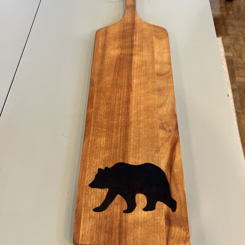 Weston Bowl Cutting Board,
Size: 22 X 6
Weston Bowl Mill in Weston Vermont
This board has been branded with a bear, a leather strap has been attached and reconditioned with mineral oil  Already for your charcuterie delights!!