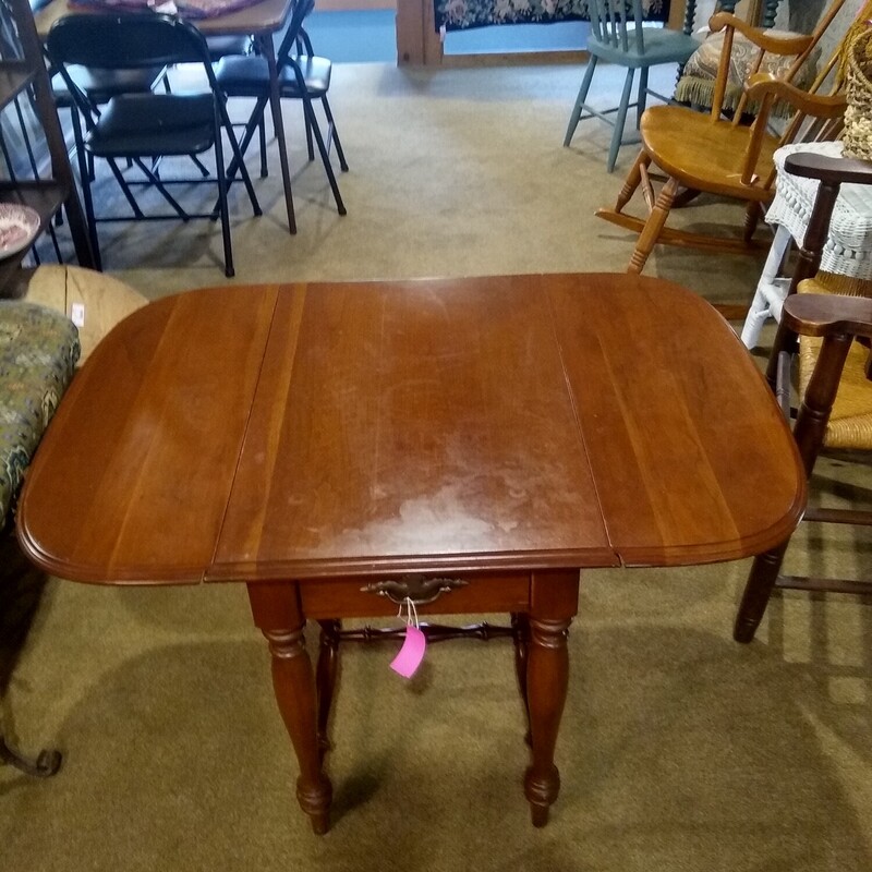 Ethan Allen DropLeaf Tble<br />
<br />
Ethan Allen drop leaf table with one drawer.<br />
<br />
Size:  Closed 18 in wide X 27 in deep X 24 in high<br />
            Open 38 in wide X 27 in deep X 24 in high