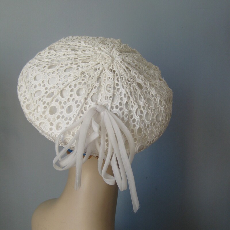 This slouchy beret is made of white lace and has a flourish of noodly nylon ribbons at the back. It's from Macy's and measures about 211.25 around on the inside. You can push and pull it to make different shapes and where on different spots on your head also for lots of looks. And it will stay on without pins.<br />
<br />
Super cute!<br />
just about perfect vintage condition, no flaws.<br />
<br />
Thank you for looking<br />
#65545