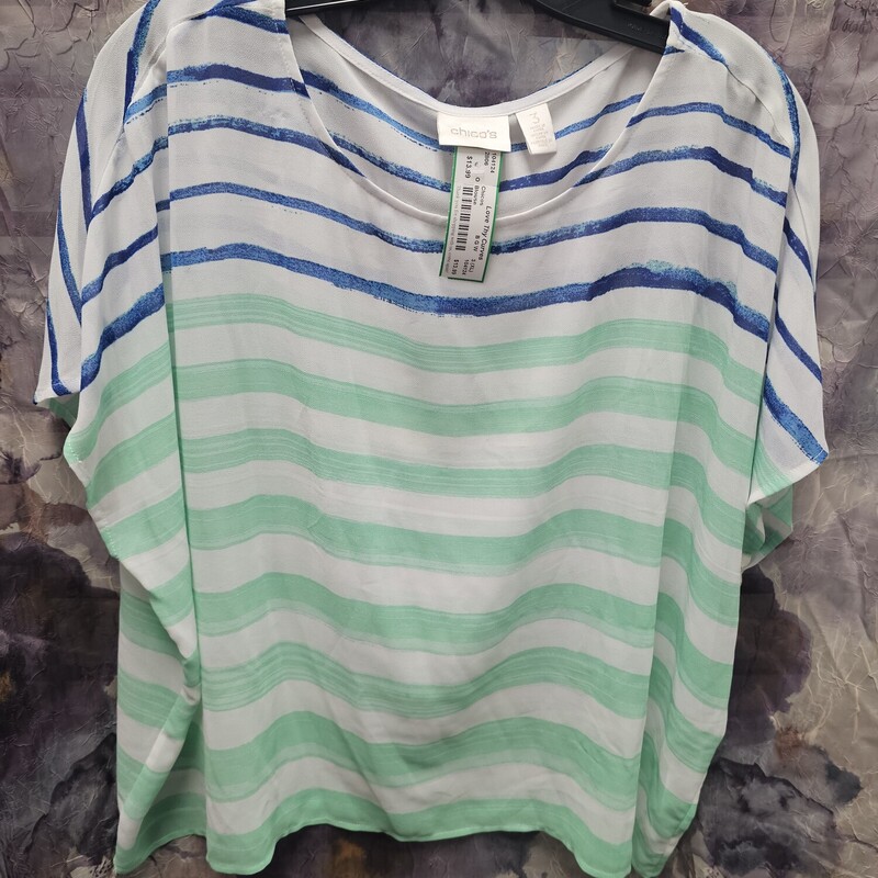 White blouse with blue and green striping.