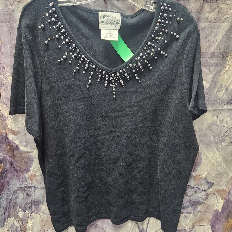Short sleeve black tee with rhinestone and pearls on the neckline.