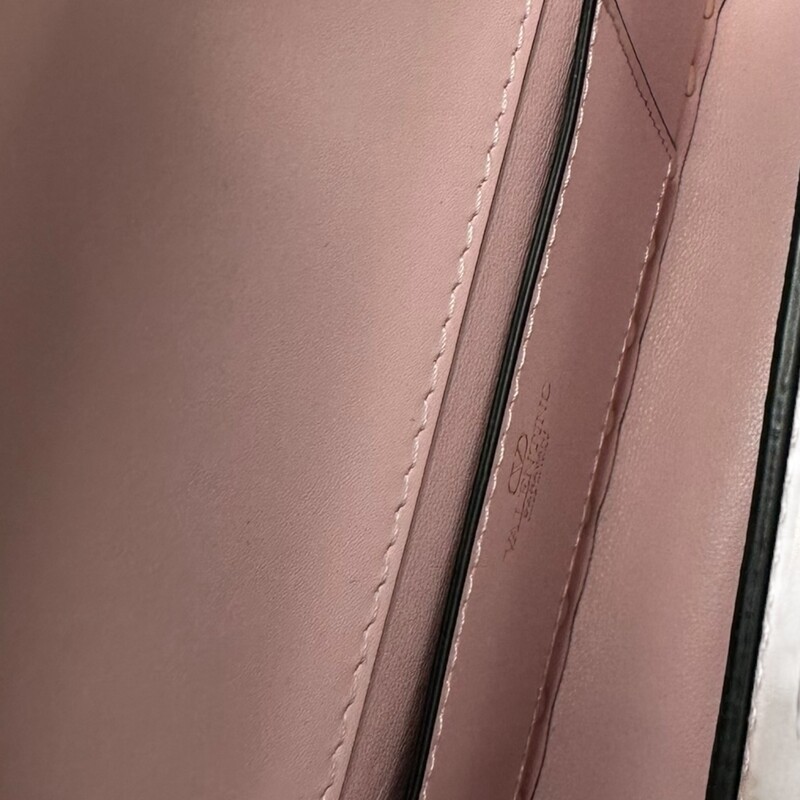 Valentino Rockstud23 East-West Pink Handbag

Dimensions:
W 23 x H 12 x D 5 cm / W 9.1 x H 4.7 x D 2.0 in

Valentino Garavani Rockstud23 East-West shoulder bag in smooth calfskin. Tone-on-tone enameled stud trim. The bag can be worn on the shoulder/crossbody thanks to the adjustable shoulder strap.

Note: Light indentation on the leather by the lock and mark on back