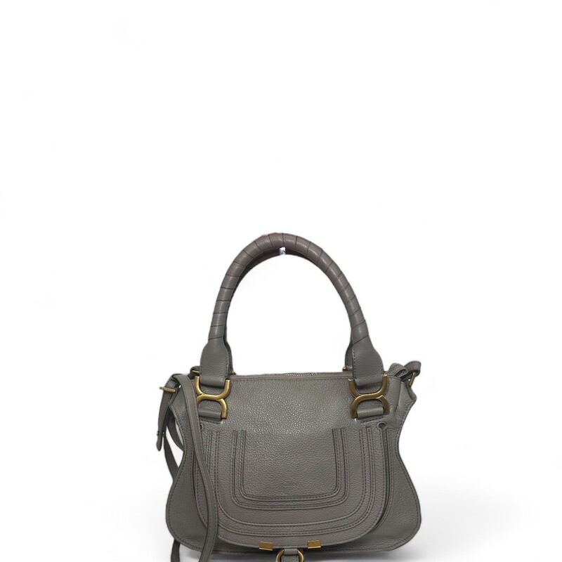 Chloé Marcie Satchel, Grey, Size: Small

Dimensions:
11.75W x 9H x 3.5D

Combining a feminine allure with '70s spirit, Chloé's iconic Marcie bag is skillfully crafted in Italy of grained leather. The French label details this slouched silhouette with equestrian-inspired saddle stitching and signature tassels.