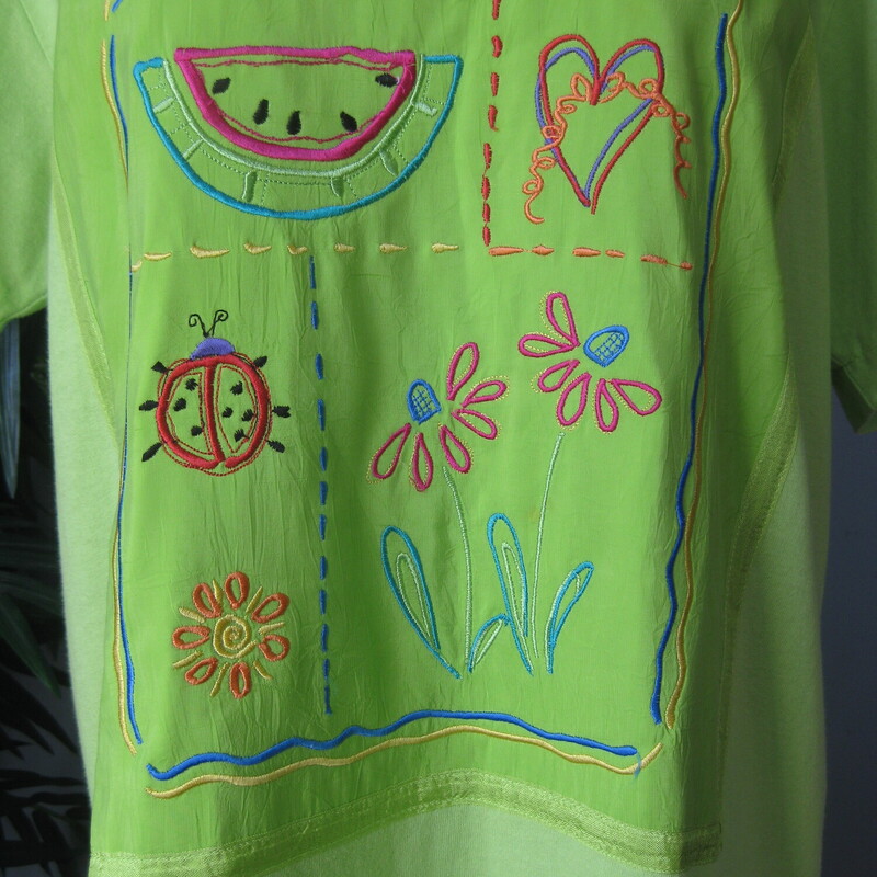 Johnny Was Tshirt Dress, Green, Size: Small<br />
Happy making chartreuse green tee shirt dress by Johnny Was<br />
This short sleeve midcalf length dress features an embroidered front panel and a crinkly flounce at the bottom.<br />
Hears, watermelon and ladybug theme<br />
100% cotton<br />
made in the USA<br />
short sleeves<br />
<br />
It's marked size S but I am listing it as a size large because it is SO roomy, here are the flat measurements:<br />
shoulder to Shoulder: 18<br />
armpit to armpit: 22<br />
waist area: 22<br />
hip area: 23<br />
length: 46.5<br />
<br />
excellent like new condition!<br />
<br />
thanks for looking!<br />
#69751