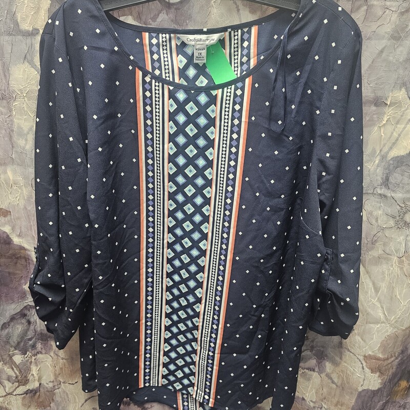 Short sleeve navy blue blouse with white teal and orange design.