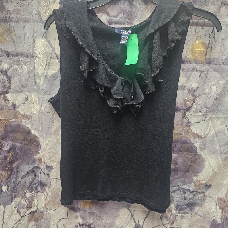 Sleeveless knit top in black with ruffled neck.
