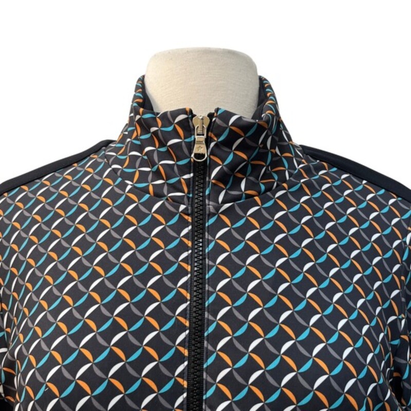 Lohla Sport Zip Jacket<br />
Golf Attire<br />
Graphic Design Print<br />
With Zip Pockets<br />
Black, Orange, Aqua, Gray and White<br />
Size: M/L