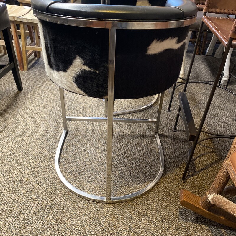 Arteriors Calvin Counter, Set Of 2<br />
<br />
Size: 23Wx22Dx23H<br />
<br />
Transitional box style low barstool with low curved back is supported by polished nickel finish on stainless steel frame. Seat upholstery features top grain seat and detailed with black and white hide back.