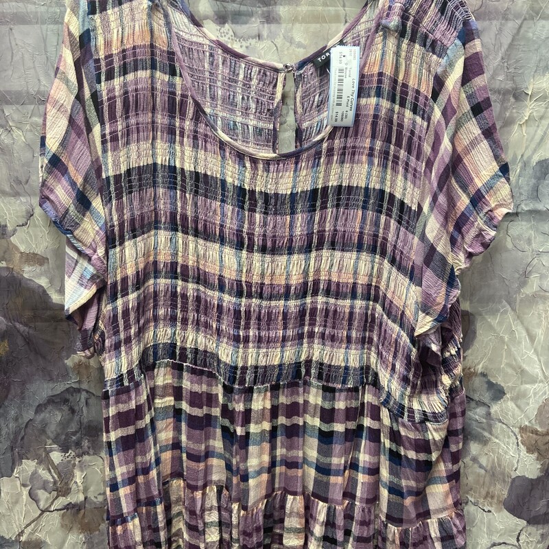 Short sleeve plaid in pinks blues purples and beige. Babydoll style cut and super cute.