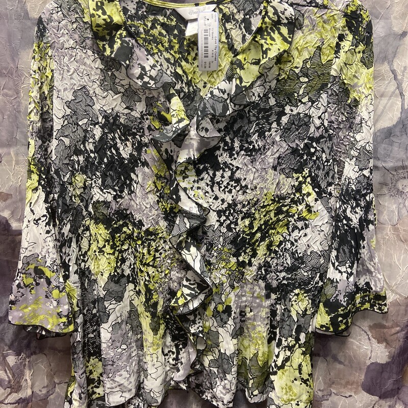 Blouse with crepe like material black white and grey with lime green print and ruffles.