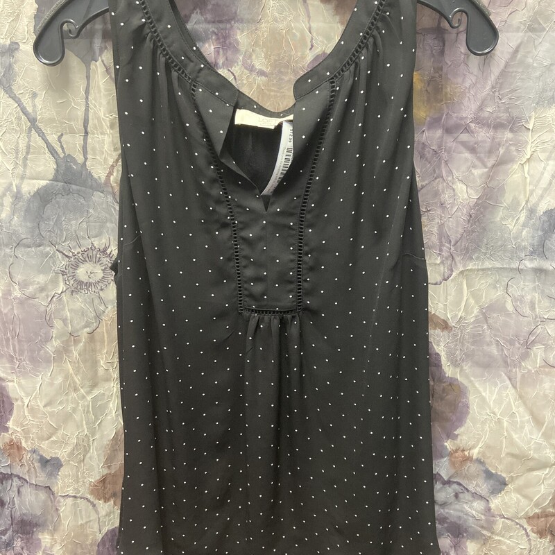Sleeveless blouse in black with white polka dots