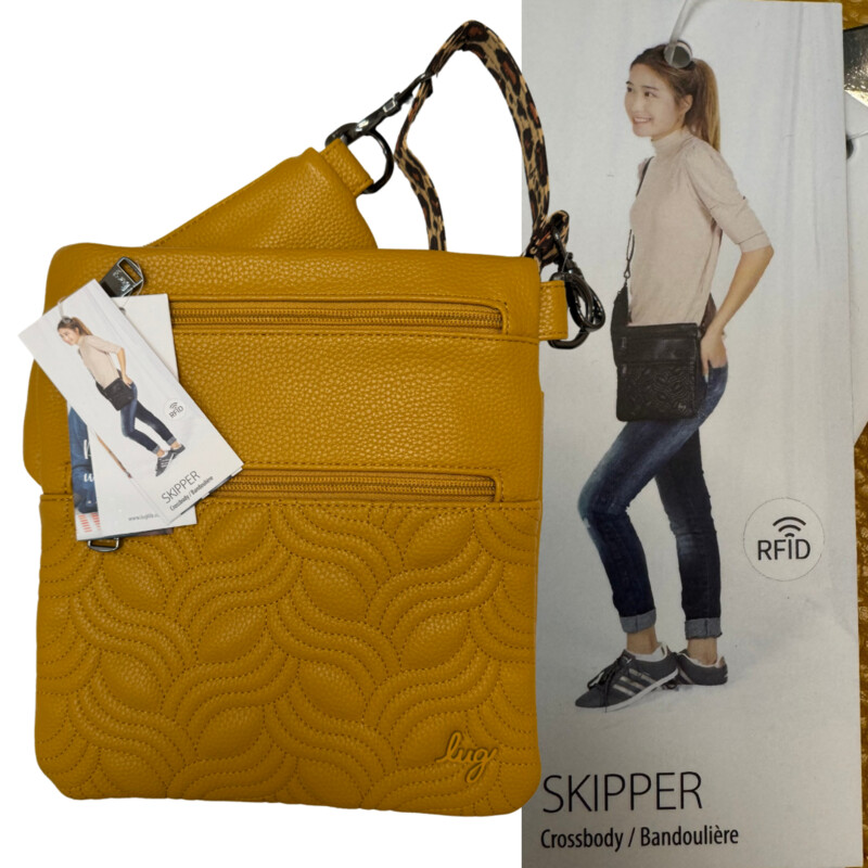 New Lug Skipper Crossbody<br />
RFID Protected<br />
Soft Lined Cellphone Pocket<br />
Quick Access Soft Pocket<br />
Vegan Leather<br />
Color: Amber