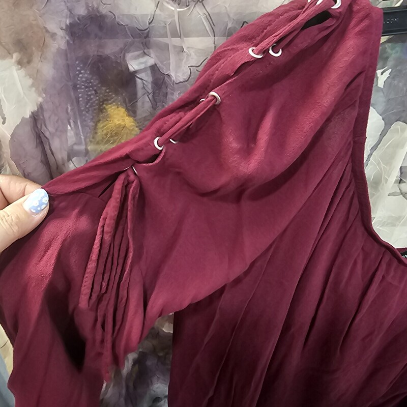 Super cute blouse that can be worn off the shoulders wtih lattice style tie up sleeves in burgandy