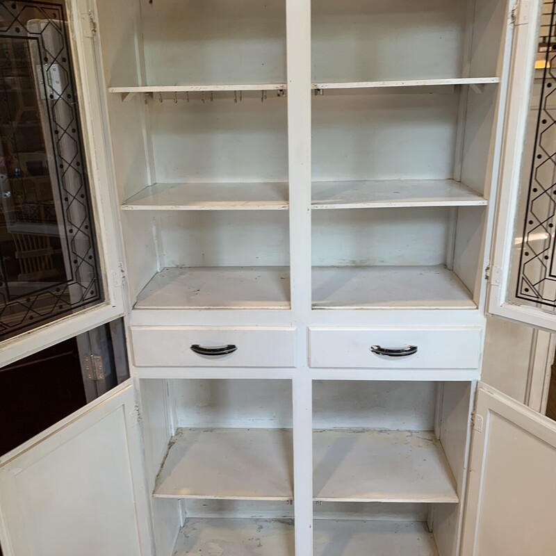 Vtg Deco Art Hutch
Size: 31x13x65

Great vintage white hutch with glass doors with an art deco design.  There are also two drawers and two cupboard doors below with two shelves.  There is an adjustable towel rack on the outside edge.  Great piece for storage.