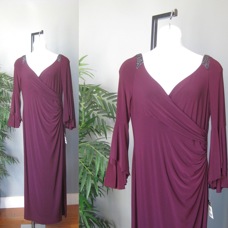 NWT LRL Jewel Bellslv, Plum, Size: XL<br />
Formal featuring beautiful 2 tiered bell sleeves and discrete beading at the shoulder.<br />
Draped and ruched to one side with a long slit at that hip.<br />
NWT by Lauren Ralph Lauren<br />
size 18<br />
polyester jersey with stretch<br />
flat measurements:<br />
armpit to armpit: 21<br />
waist: 18.5<br />
hip: 24<br />
length: 60<br />
underarm sleeve seam: 16<br />
slit: 25<br />
<br />
thanks for looking!<br />
#72507