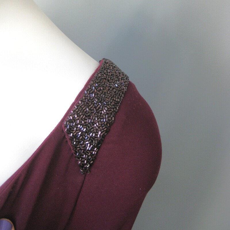 NWT LRL Jewel Bellslv, Plum, Size: XL<br />
Formal featuring beautiful 2 tiered bell sleeves and discrete beading at the shoulder.<br />
Draped and ruched to one side with a long slit at that hip.<br />
NWT by Lauren Ralph Lauren<br />
size 18<br />
polyester jersey with stretch<br />
flat measurements:<br />
armpit to armpit: 21<br />
waist: 18.5<br />
hip: 24<br />
length: 60<br />
underarm sleeve seam: 16<br />
slit: 25<br />
<br />
thanks for looking!<br />
#72507