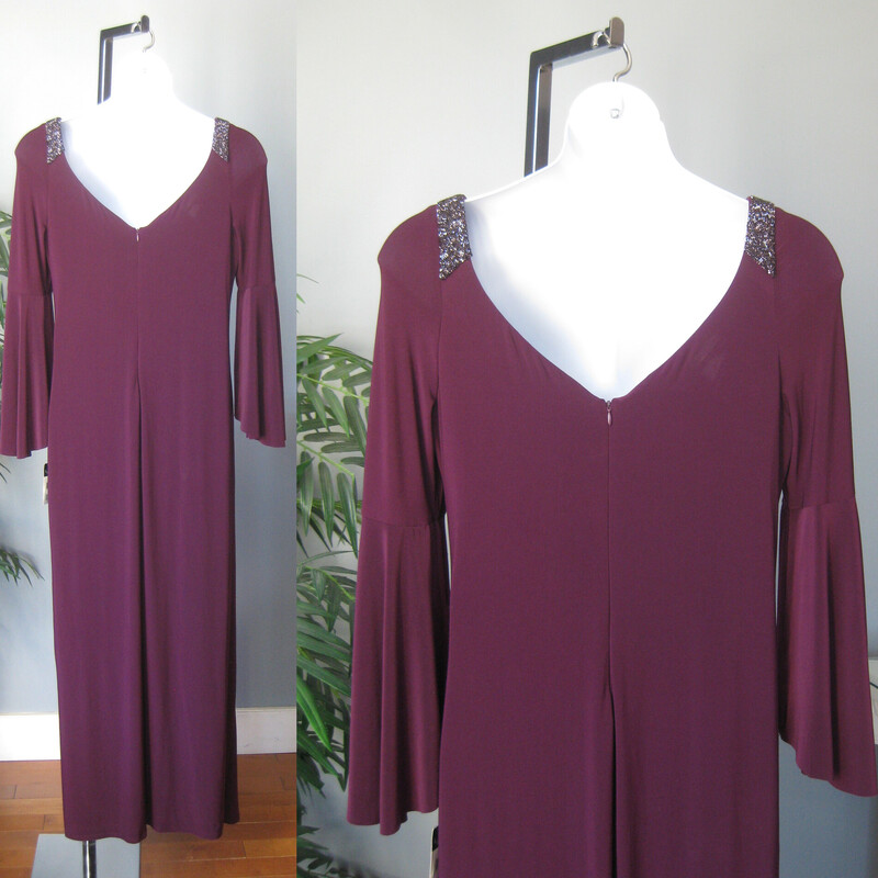 NWT LRL Jewel Bellslv, Plum, Size: XL<br />
Formal featuring beautiful 2 tiered bell sleeves and discrete beading at the shoulder.<br />
Draped and ruched to one side with a long slit at that hip.<br />
NWT by Lauren Ralph Lauren<br />
size 18<br />
polyester jersey with stretch<br />
flat measurements:<br />
armpit to armpit: 21<br />
waist: 18.5<br />
hip: 24<br />
length: 60<br />
underarm sleeve seam: 16<br />
slit: 25<br />
<br />
thanks for looking!<br />
#72507