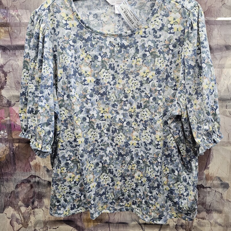 Half sleeve floral print top with elastic cuffed sleeves. Super cute for summer.