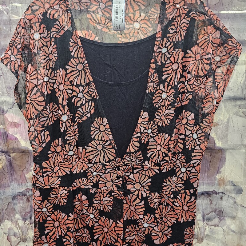 Sheer top layer with short sleeves in black and orange pattern with sewn in tank panel of solid black underneath