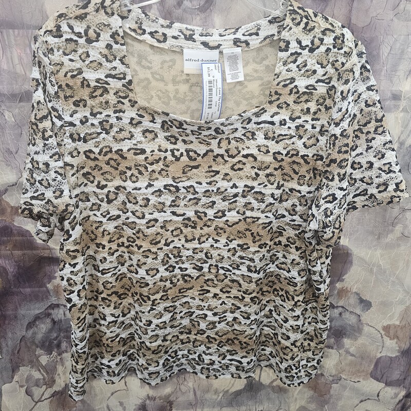 Leopard printed, lacey ruffled blouse with short sleeves. Summer fun wear.