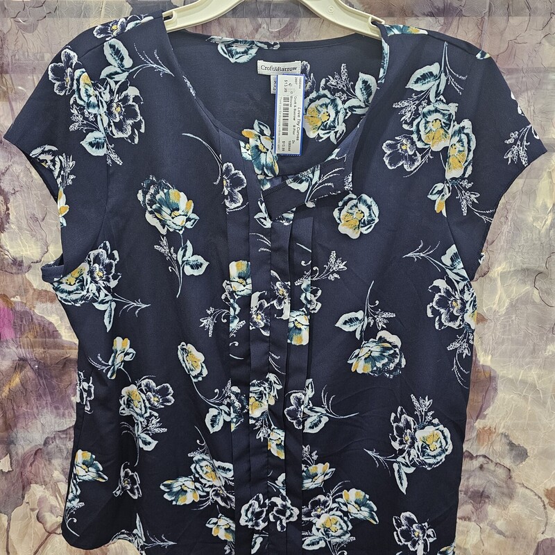Short sleeve navy  blouse with a floral print in white green and yellow