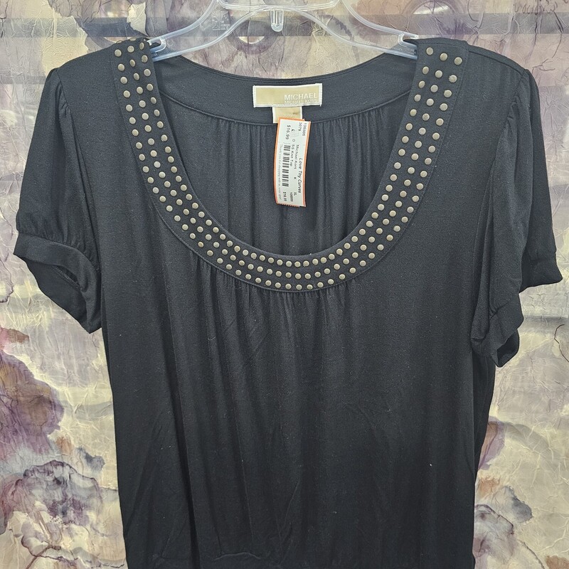 Short sleeve knit top in black with studding around the neckline.