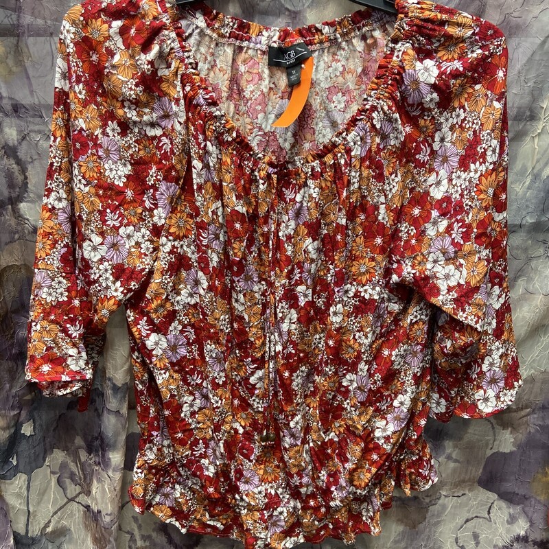 Half sleeve blouse that is great for summer in red with floral print.